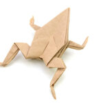 Origami frog isolated on white background
